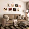 A display shelf featuring various vinyl records and album covers mounted on a white wall.