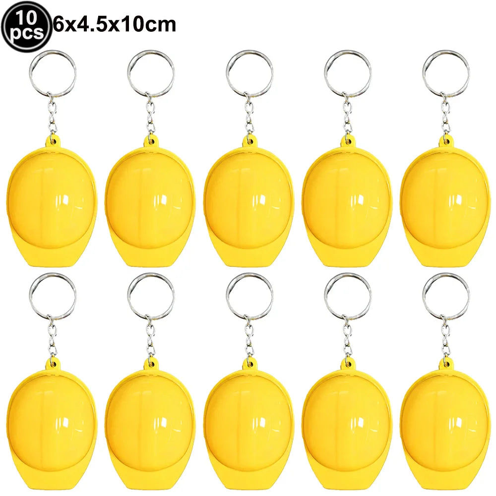 A set of ten yellow construction vehicle themed birthday party tableware items.