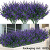 A bundle of artificial purple lavender stems used for outdoor decoration.