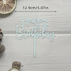 Elegant acrylic birthday cake topper with gold lettering on a light wooden background.
