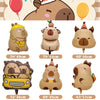 A set of plush capybara-themed birthday party decorations including a bear, a small animal, and a yellow car.
