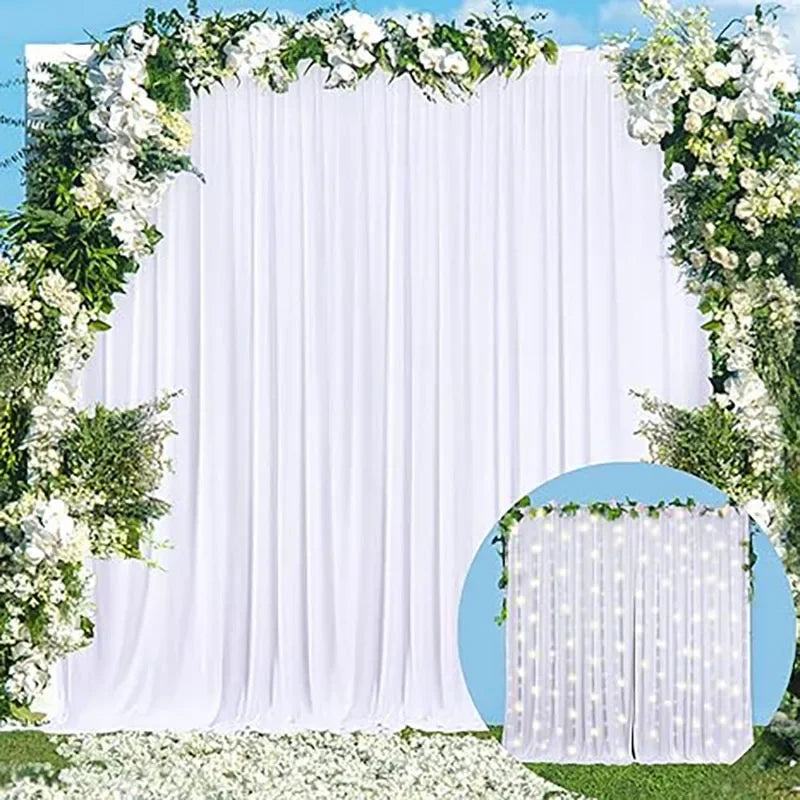Elegant white rectangular backdrop drapes decorated with greenery and white flowers for events