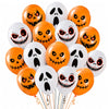 A collection of orange and white latex balloons featuring various spooky, Halloween-themed prints like skulls and grinning fa