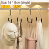 Black closet hooks displaying four pieces of clothing and accessories like hats and scarves on a rack