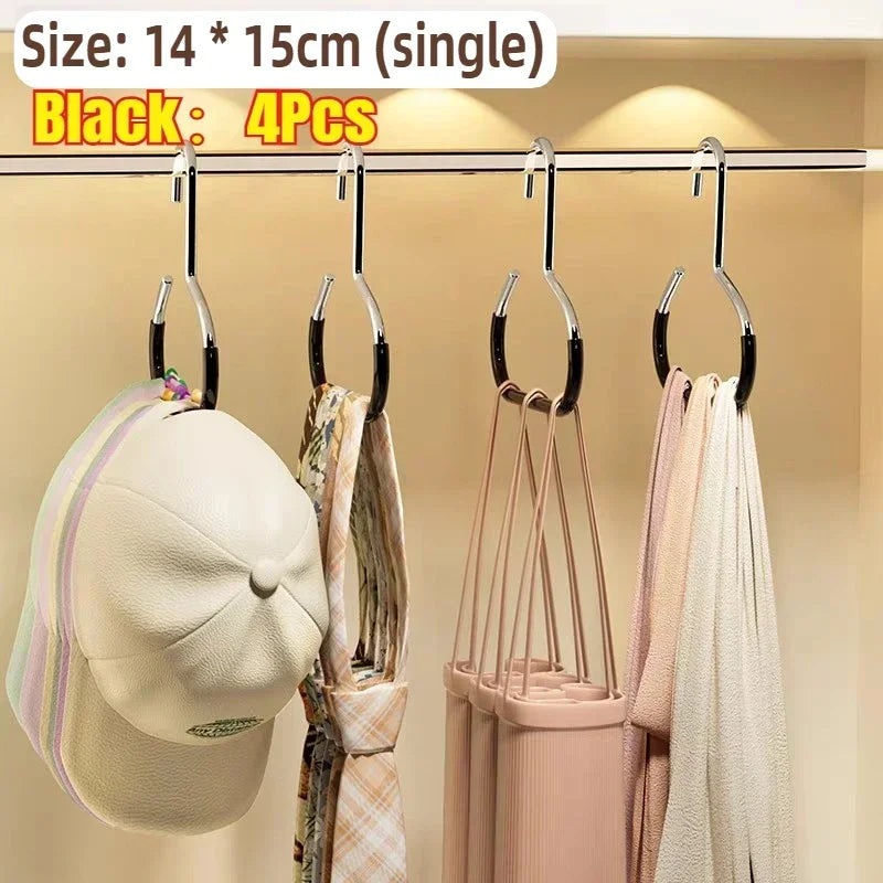 Black closet hooks displaying four pieces of clothing and accessories like hats and scarves on a rack