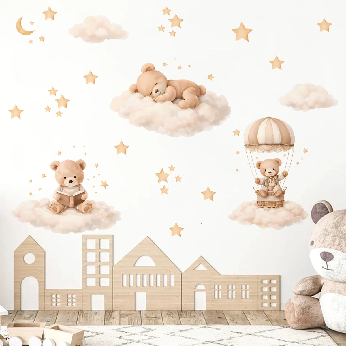 Wall stickers featuring cartoon bears, clouds, and stars decorating a wooden building silhouette.
