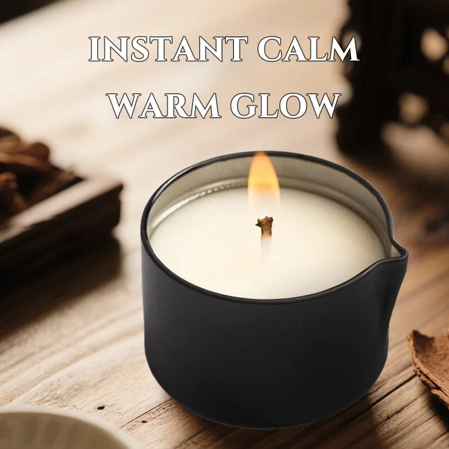 A dark candle in a ceramic holder with a lit wick, creating a warm glow for instant calm.