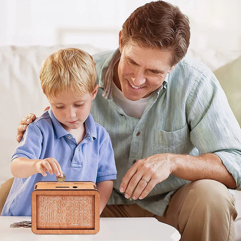 A man is helping a young boy use a reusable wooden piggy bank to save money.