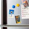 Square photo frame magnets on a refrigerator featuring a woman, a yellow circle, and a to-do list.