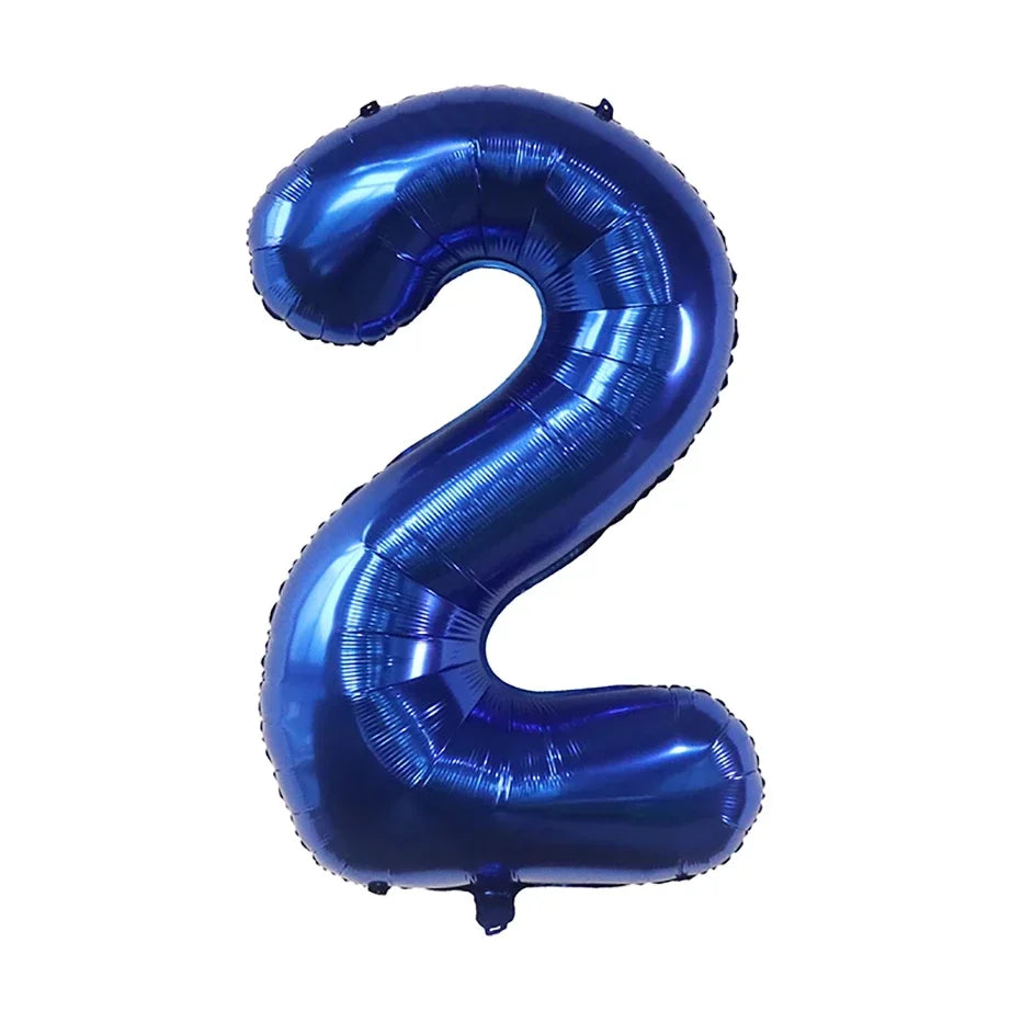 A large, dark blue foil number balloon shaped like the number 2.