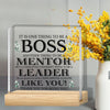 A clear acrylic plaque with engraved text appreciating a boss, mentor, and leader.