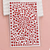 A sheet of red and clear glitter gems for stick-on facial tattoos.