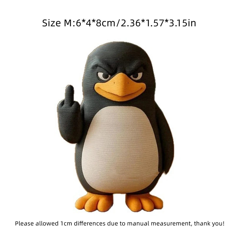A black and white penguin desk statue with one flipper raised in a thumbs-up gesture.