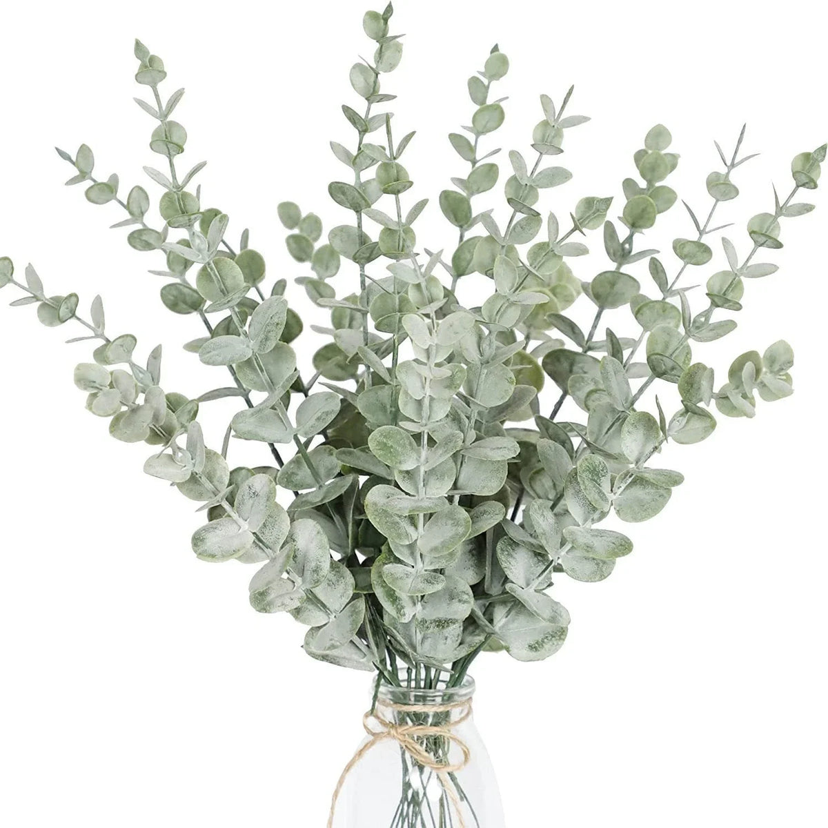 A bouquet of silvery-green artificial baby's breath flowers arranged in a clear glass jar.