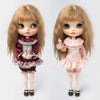 A pair of vintage lace pajama sets for 1/6 dolls, featuring a maroon and pink ruffled outfit with blonde hair.