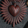 A dark brown Gothic sacred heart wall plaque featuring a heart surrounded by radiating rays.