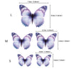 Three butterfly cake toppers of varying sizes and shades purple and white