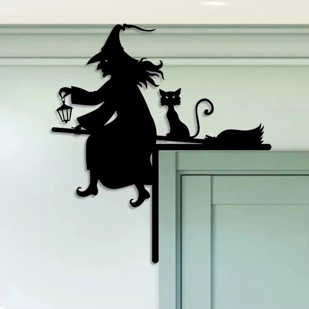 A black silhouette of a witch with a pointed hat and a broomstick, standing next to a cat and a silhouette of a bird on a whi
