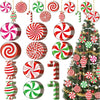 A collection of colorful striped and swirling Christmas wooden candy cane hanging ornaments.