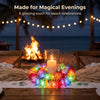 A glowing LED flower crown headband with colorful lights placed on a wooden table for beach celebrations.