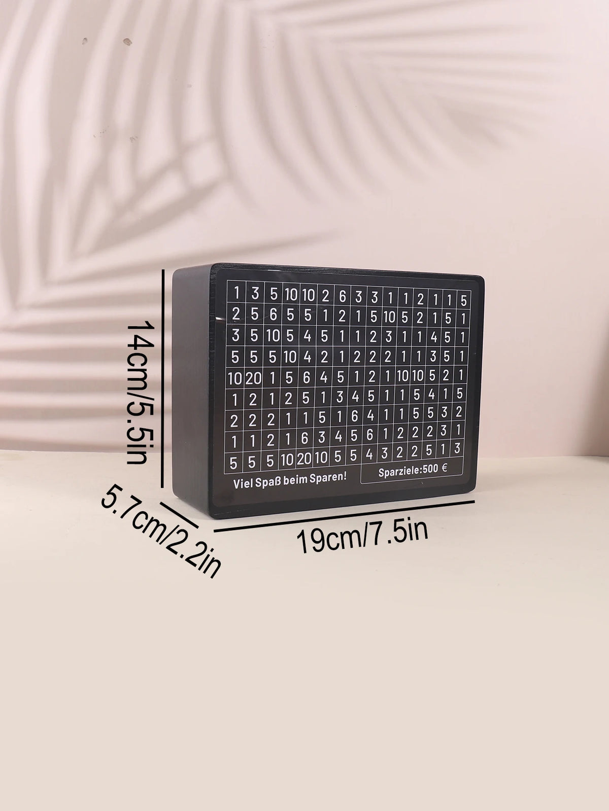 A black wooden piggy bank savings box with numbered slots and dimensions shown.
