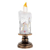 A festive snowflake candle featuring a wind lamp effect set in a brass-toned base.