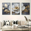 A set of three modern abstract floral wall art prints featuring white and gold leaves on a dark background.