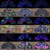 A collection of fluorescent and UV glow folding rave hand fans in various patterns and colors.