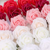 A close-up display of realistic foam rose flower heads in shades of pink, red, and white.