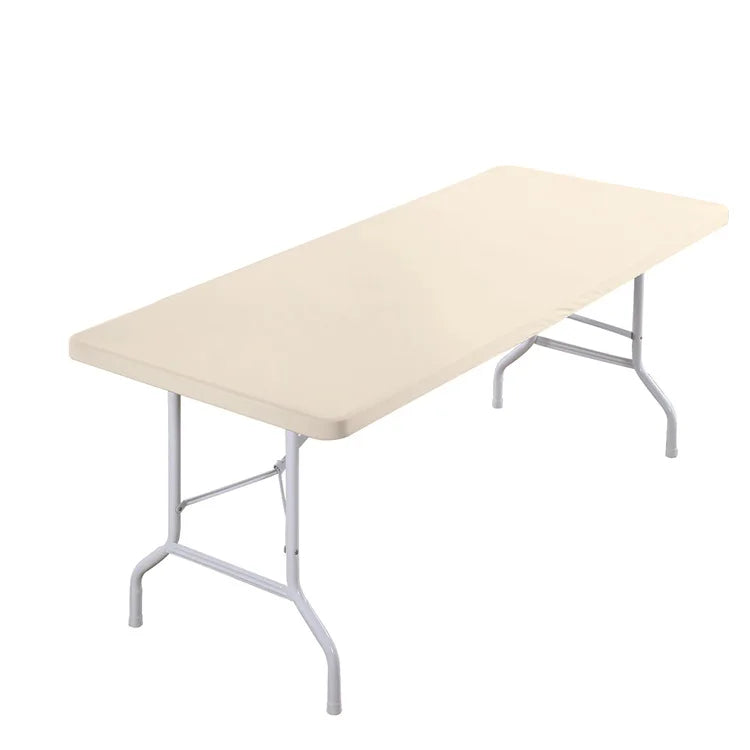 A rectangular table covered with a beige stretch elastic tablecloth.