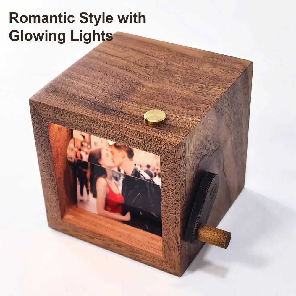 A wooden hand-crank flip photo frame with a glowing light, featuring a photo inside.