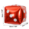 A glossy red foil balloon shaped like a die with white polka dots.