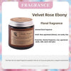 A jar of Velvet Rose Ebony floral fragrance candle with a silver lid and label