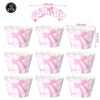 A set of pink and white patterned paper cups with pink bows for a birthday party theme.