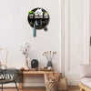 A circular wooden wall key holder with a shelf mounted on a white wall.