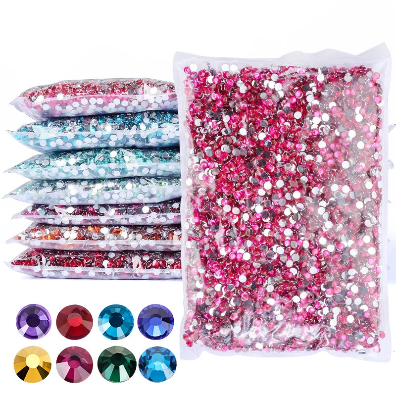 A collection of round flatback resin rhinestones in various colors and shades, packaged for crafts and decor.
