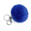 A bright royal blue faux fur pom pom attached to a silver chain keychain.