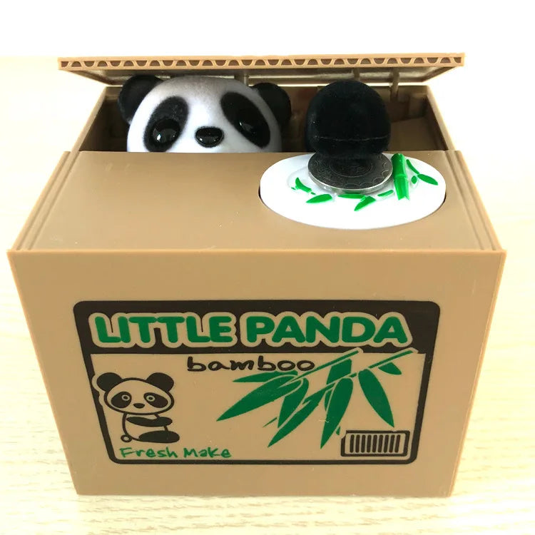 A cardboard box containing a panda figure and bamboo leaves, designed as an interactive coin bank for kids.