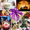 A purple gift box tied with a ribbon sits next to a festive Halloween scene featuring pumpkins and bats.