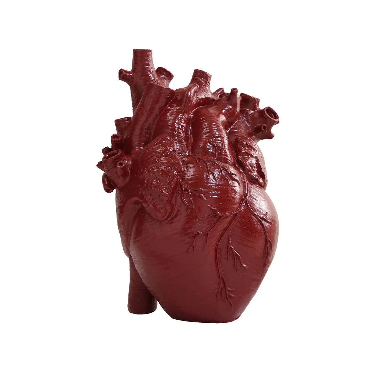 A reddish-brown resin sculpture of a human heart, shaped like a tabletop vase.