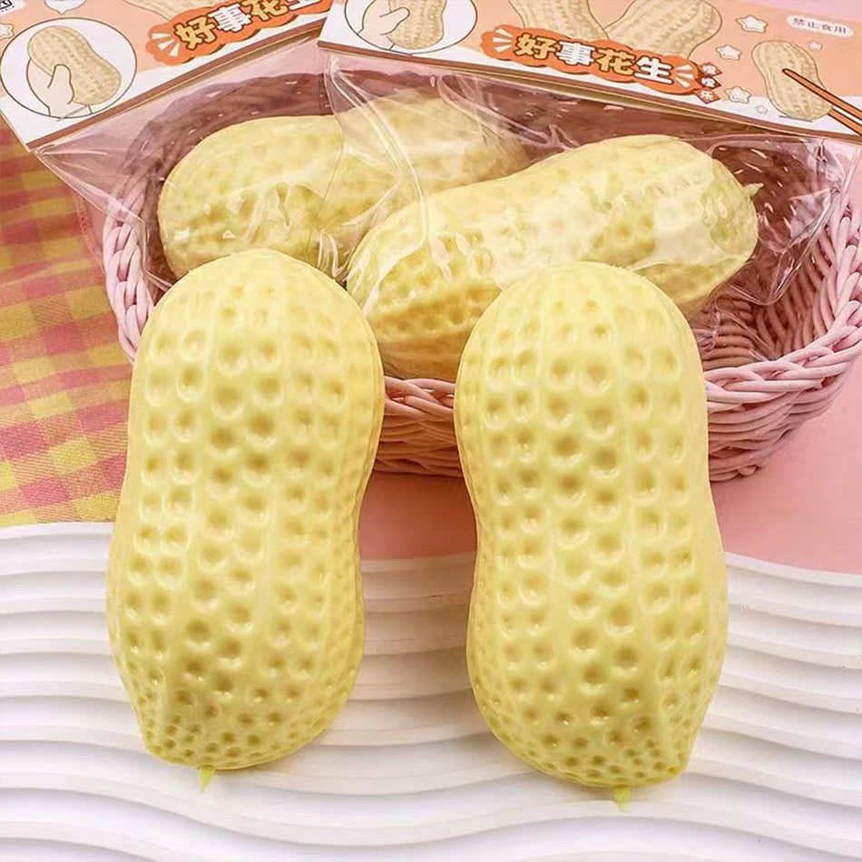 Two yellow peanut-shaped stress balls are displayed in a basket with packaging.