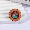 An enamel pin featuring a dumpster fire graphic and the text Dumpster Fire Response Team.