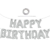 A string of silver foil balloons spelling out HAPPY BIRTHDAY with a circular balloon at the top