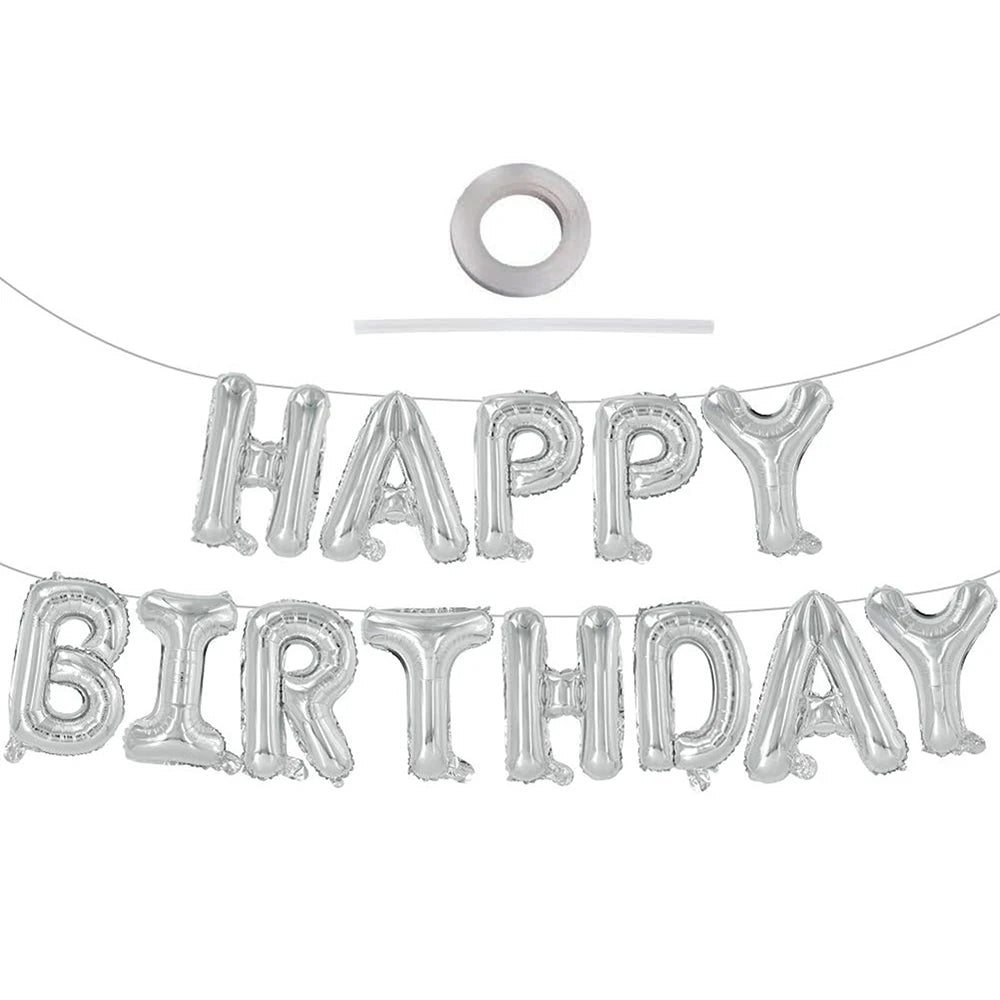 A string of silver foil balloons spelling out HAPPY BIRTHDAY with a circular balloon at the top