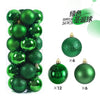 A package of 24 green Christmas ball ornaments for holiday decoration.