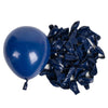 A blue latex balloon next to a pile of dark blue crumpled latex balloons.