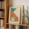 A framed abstract canvas print featuring warm earth tones and a yellow mug with steam, titled Good Morning.