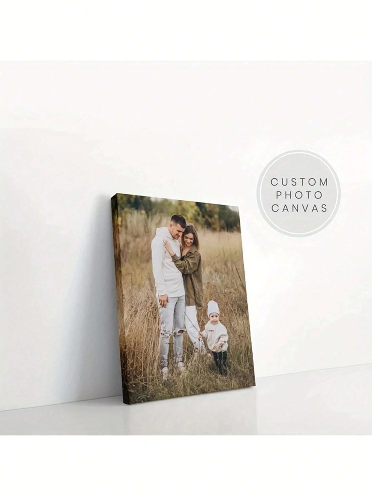 A custom framed canvas poster featuring a family of three outdoors in a grassy field.