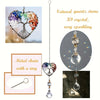 A pendant featuring a metal chain with a ring and a heart-shaped crystal tree of life sun catcher.