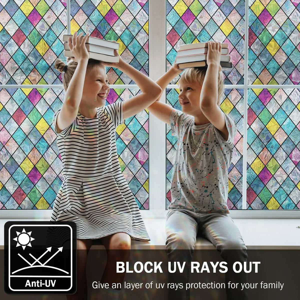 Two children look through a rainbow stained glass window film indoors